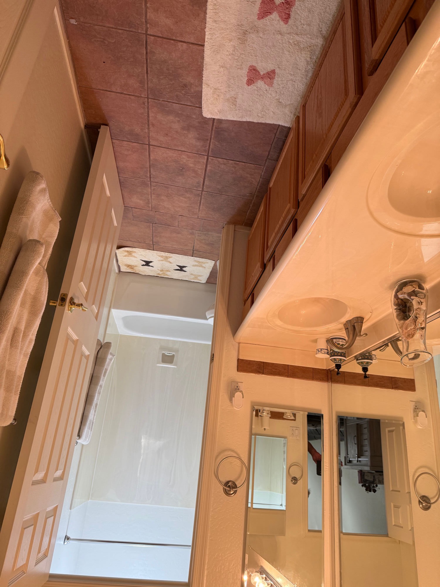 Before — dated pink tile bathroom ready for remodel